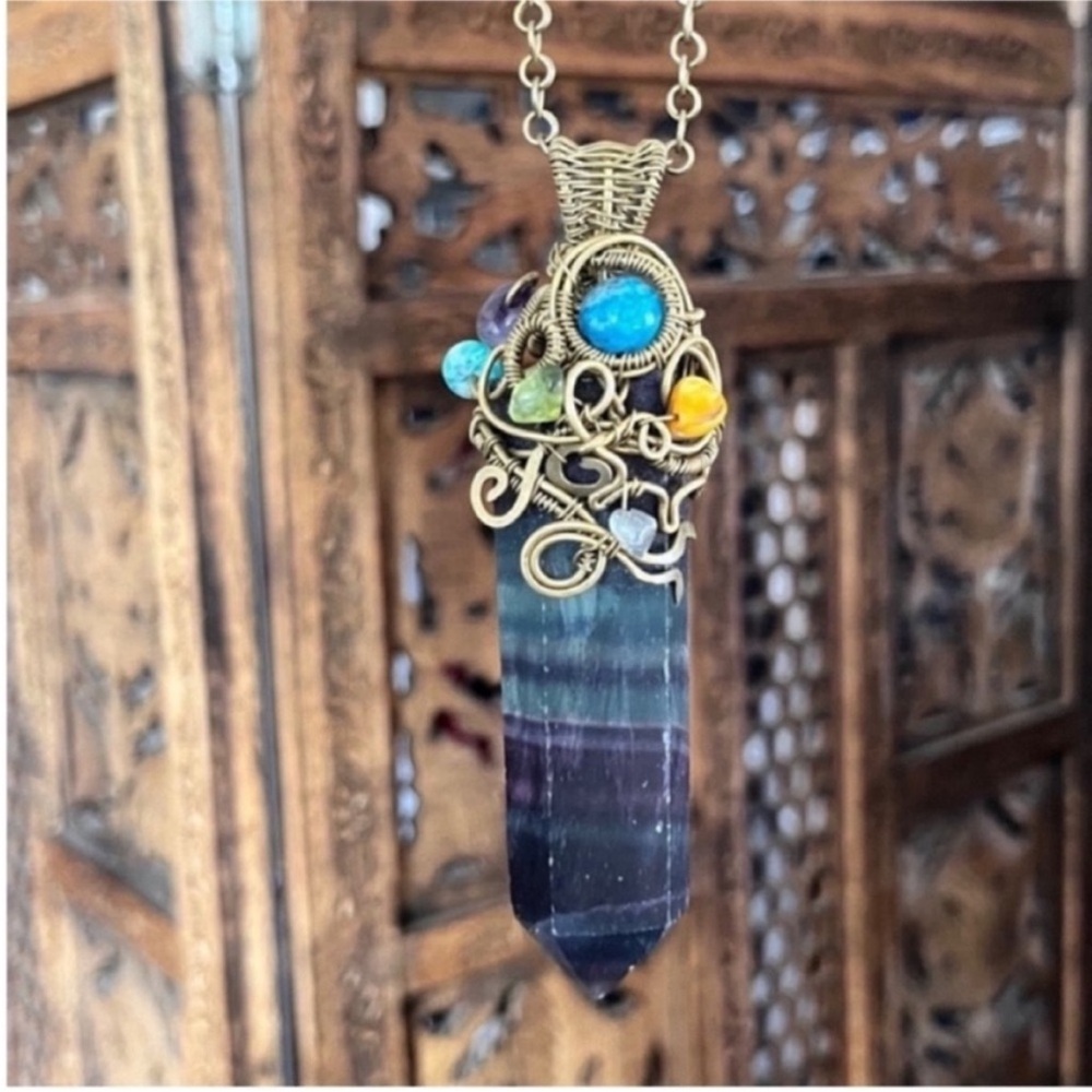 Natural rainbow fluoride crystal necklace with other gems throughout hand woven